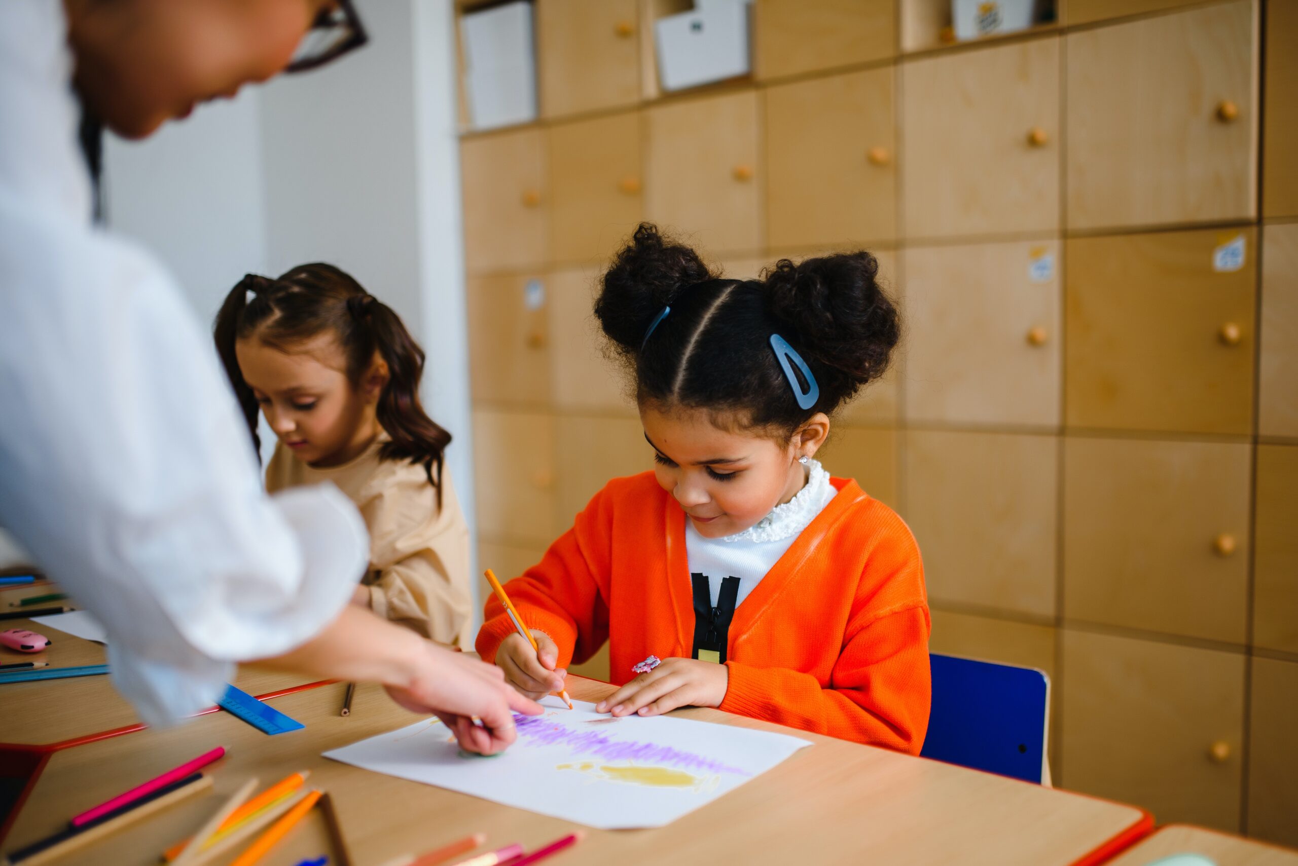 teacher helping student