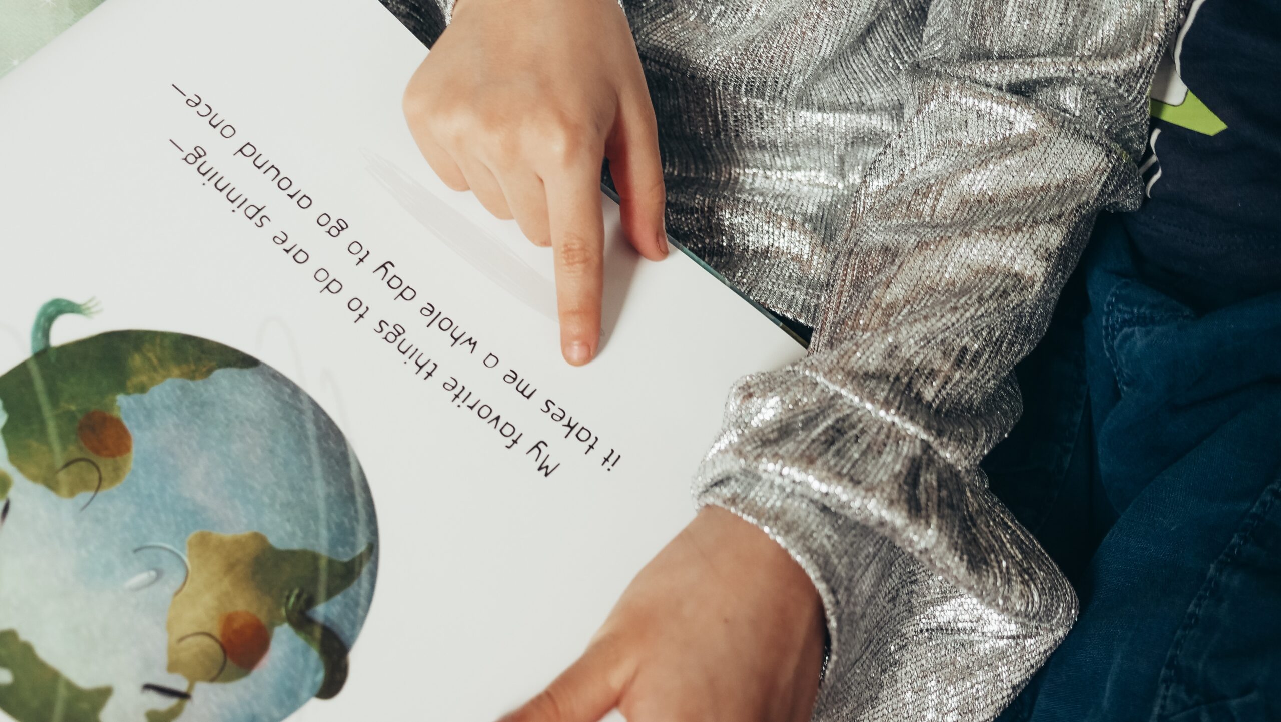 student reading a picture book