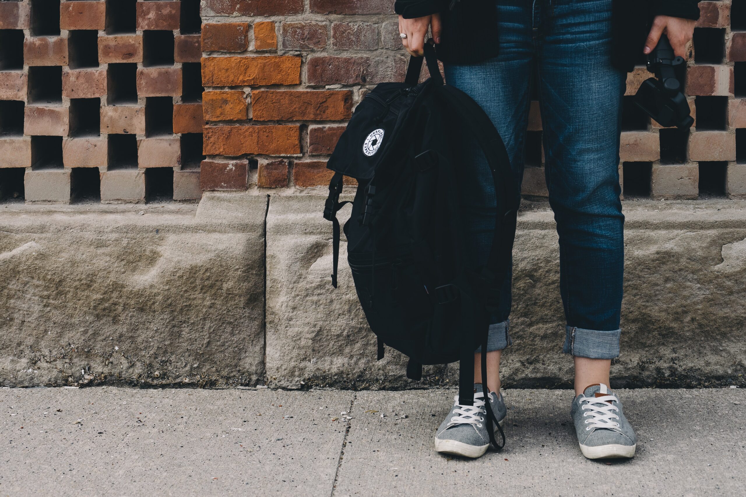 student-standing-with-backpack