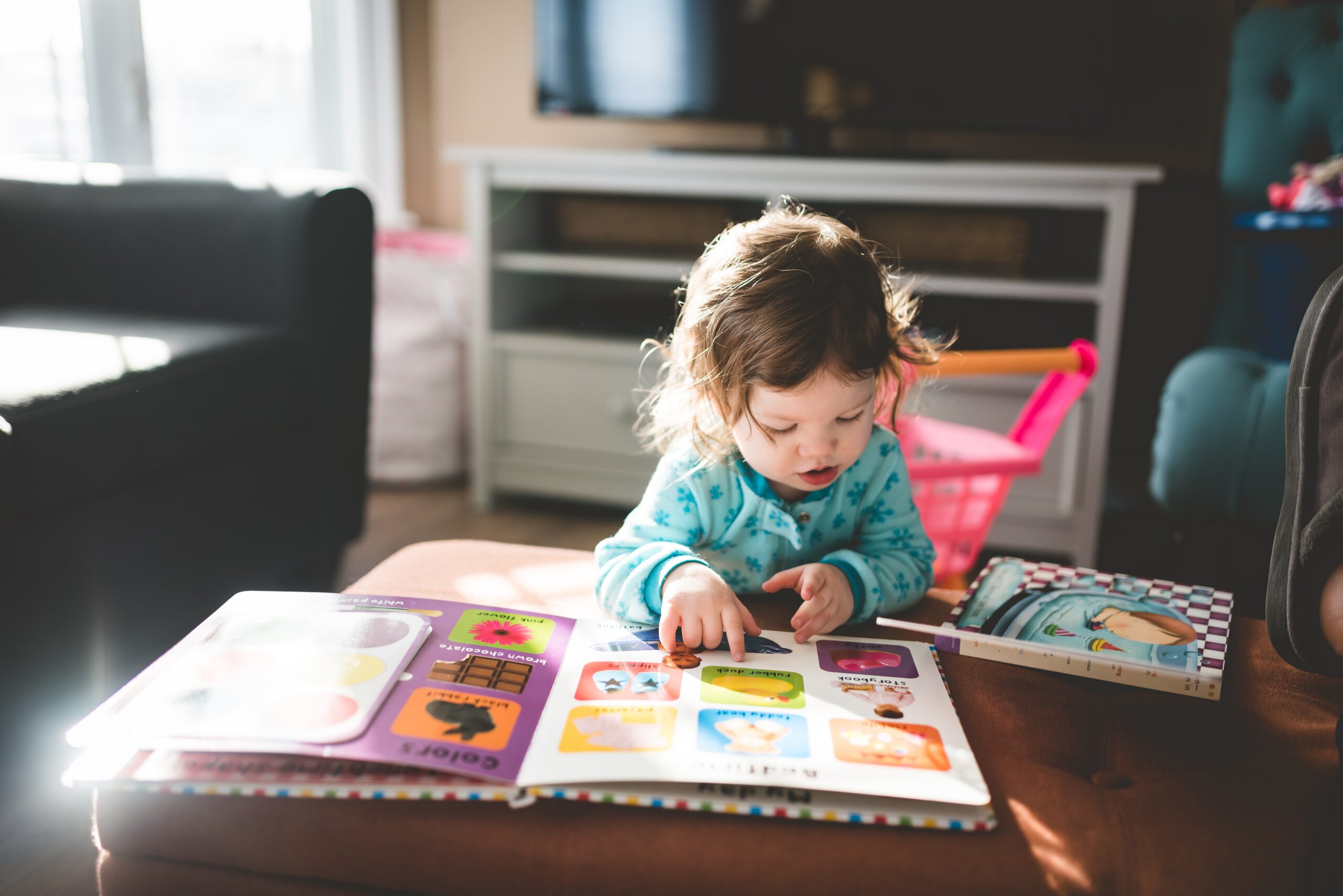 child with neurodivergent traits reading a book